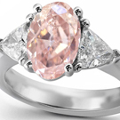 A gorgeous William Goldberg Ashoka ring is encrusted with diamonds